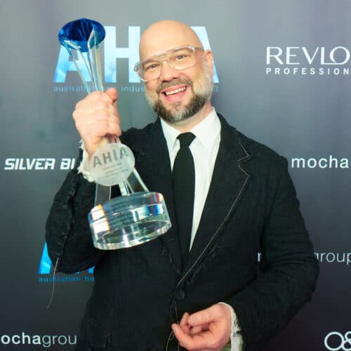 Justin Pace of Co and Pace Salons holding his trophy after winning AHIA Creative Australian Hairdresser of the Year 2023